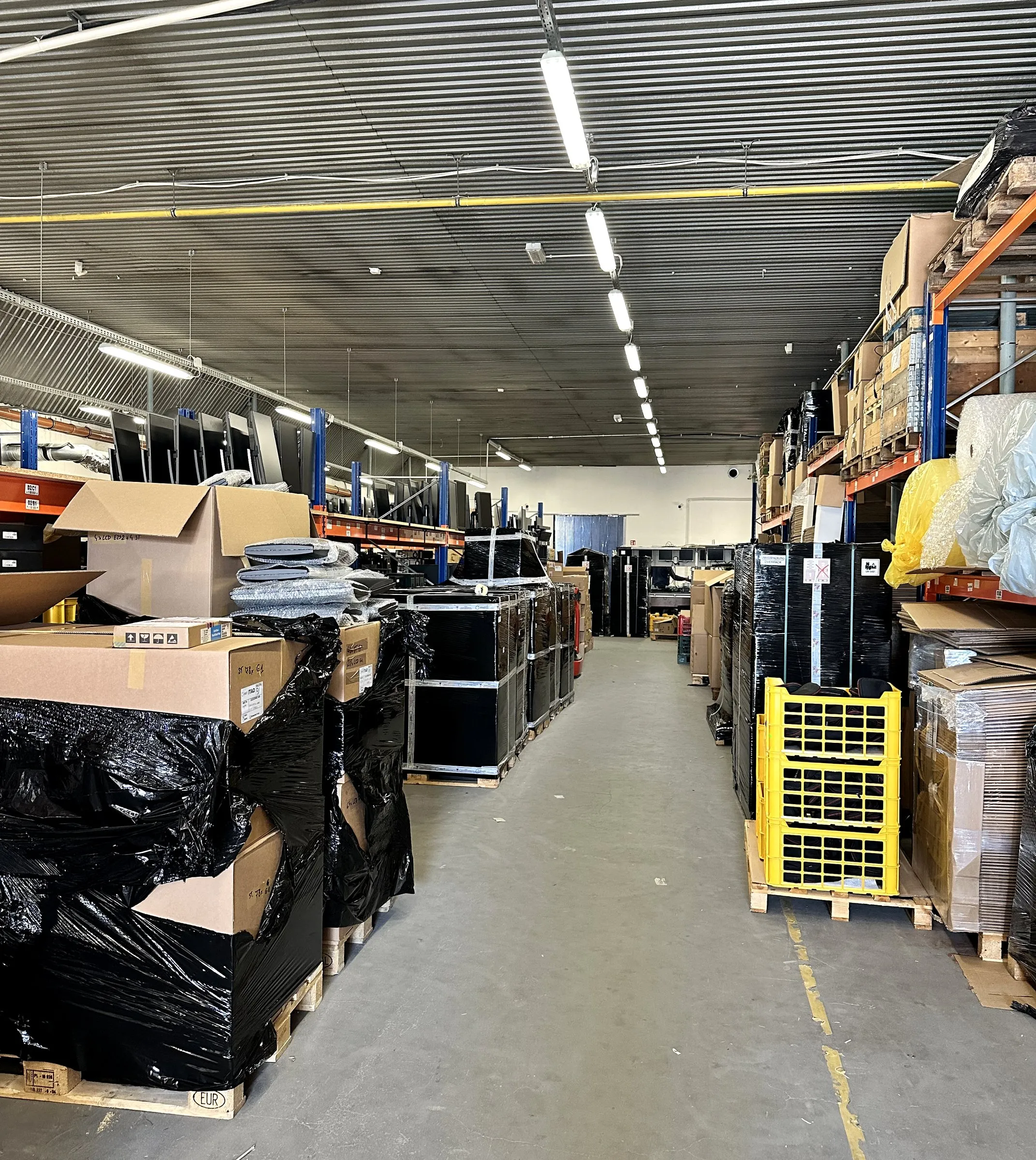 Our warehouse — an aisle of palletised IT equipment